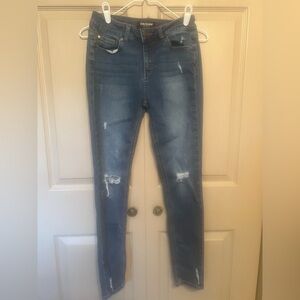 Skinny Blue Jeans with Distressed Knee Details